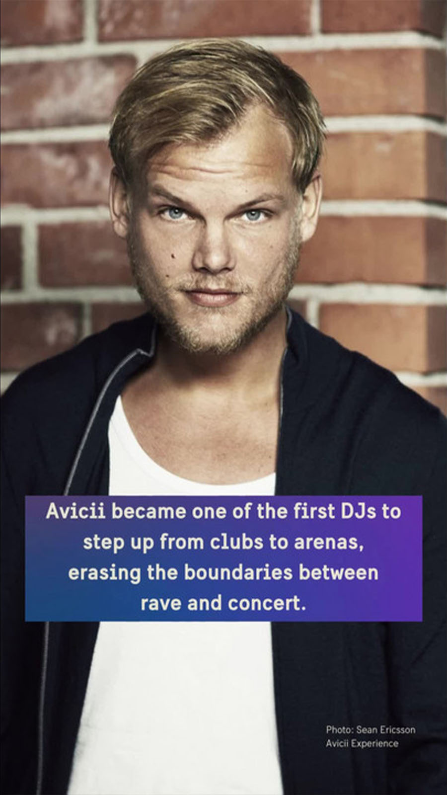 Portrait of dj and producer Avicii against a brick wall.