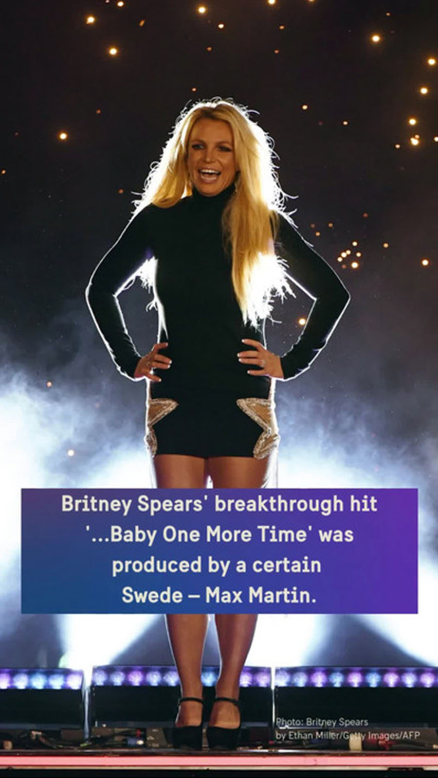 Pop singer Britney Spears on a lit-up stage.