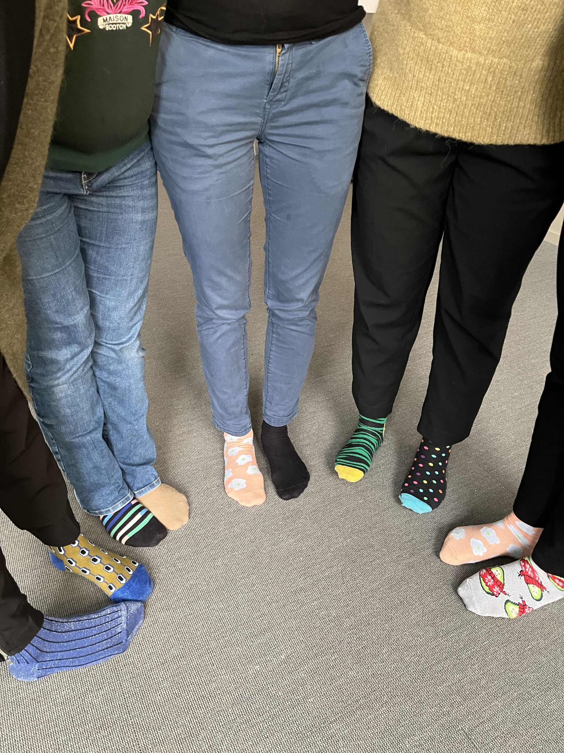 People wearing mismatched socks in different colours.